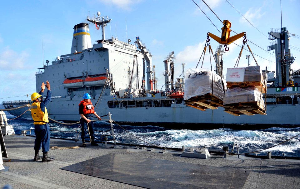 Sailors direct cargo during a replenishment-at-sea. (8455083139)