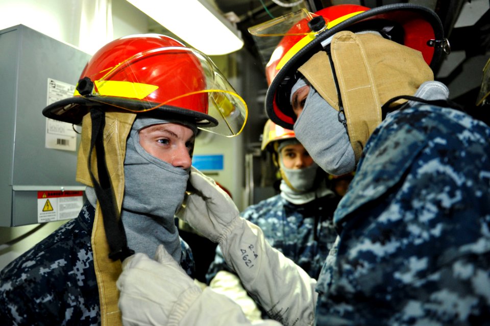 Sailors dress out for fire fighting. (8456179842)