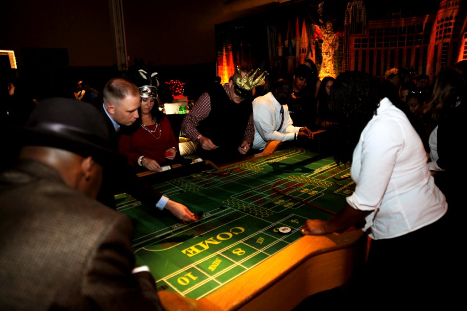 Sailors enjoy a casino at a holiday party. (8203275486)