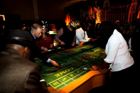 Sailors enjoy a casino at a holiday party. (8203275486)