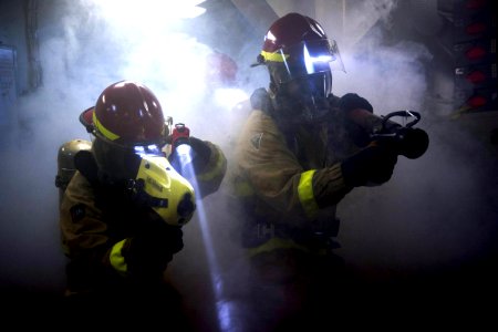 Sailors fight a simulated fire during a drill aboard the aircraft carrier USS Harry S. Truman. (21246029434)