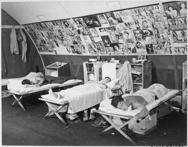 Sailors of ARU-145 (Aircraft Repair Unit), Guadalcanal, during their free time. Sack time a favorite past time. - NARA - 520658