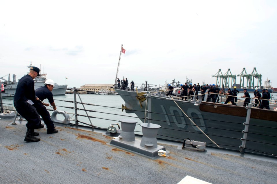 Sailors heave line as the Arleigh Burke-class guided-missile destroyers USS Howard (DDG 83) and USS Kidd (DDG 100) prepare to depart Chennai, India, for the at-sea phase of Malabar 2017