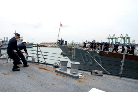 Sailors heave line as the Arleigh Burke-class guided-missile destroyers USS Howard (DDG 83) and USS Kidd (DDG 100) prepare to depart Chennai, India, for the at-sea phase of Malabar 2017