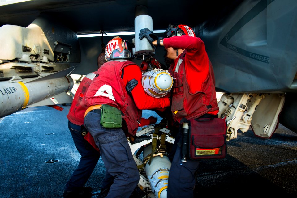 Sailors load a Mk 82 Blu 111 500 pound bomb. (16431385586)