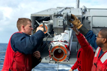 Sailors load a Sea Sparrow Missile. (8514138034)