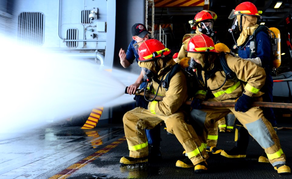 Sailors perform a firefighting exercise. (8705729518)