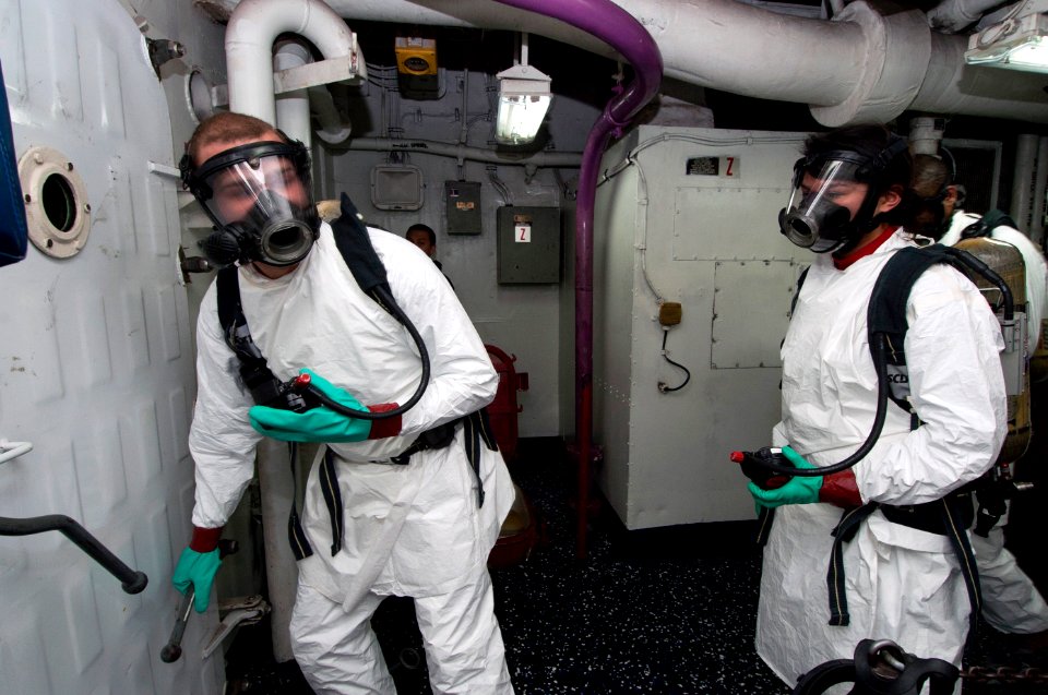 Sailors practice dealing with a feul spill at sea. (8426061083)