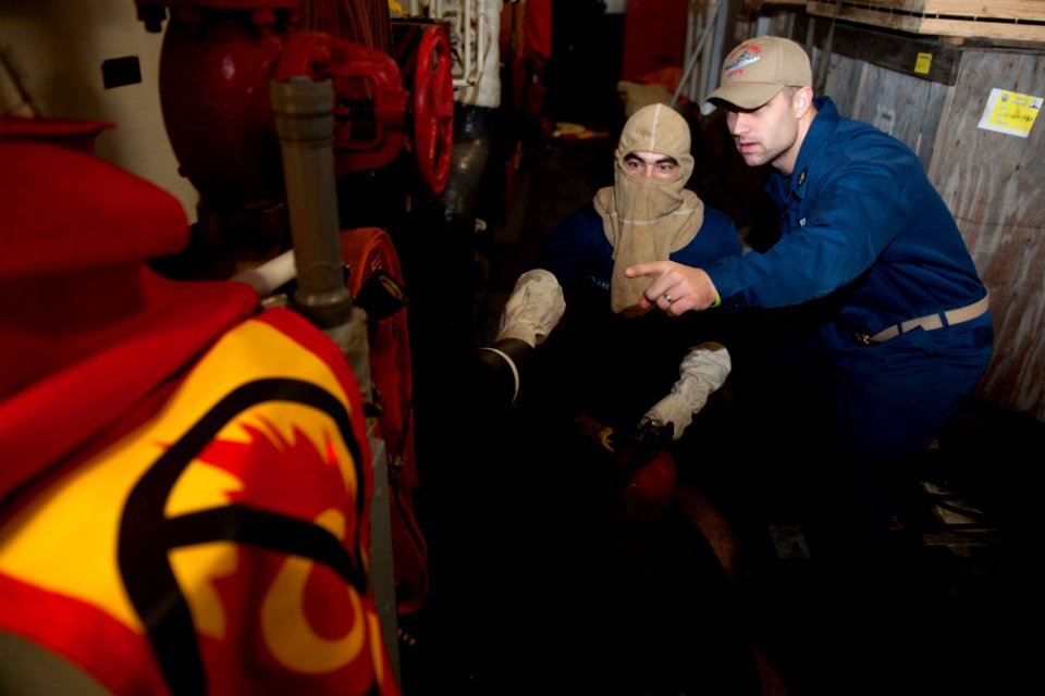 Sailors practice fire fighting at sea. (8223130855)