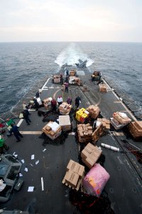 Sailors move supplies aboard USS Mobile Bay. (8243540981) photo