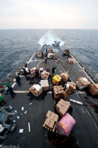 Sailors move supplies aboard USS Mobile Bay. (8243540981)