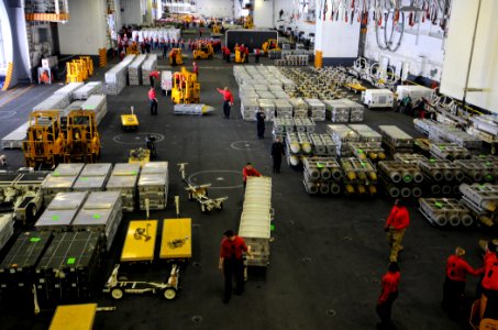 Sailors organize ordnance in the hangar bay. (8390304608) photo