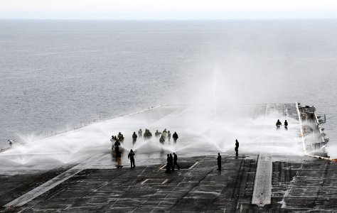 Sailors participate in a flight deck washdown. (8200232188)