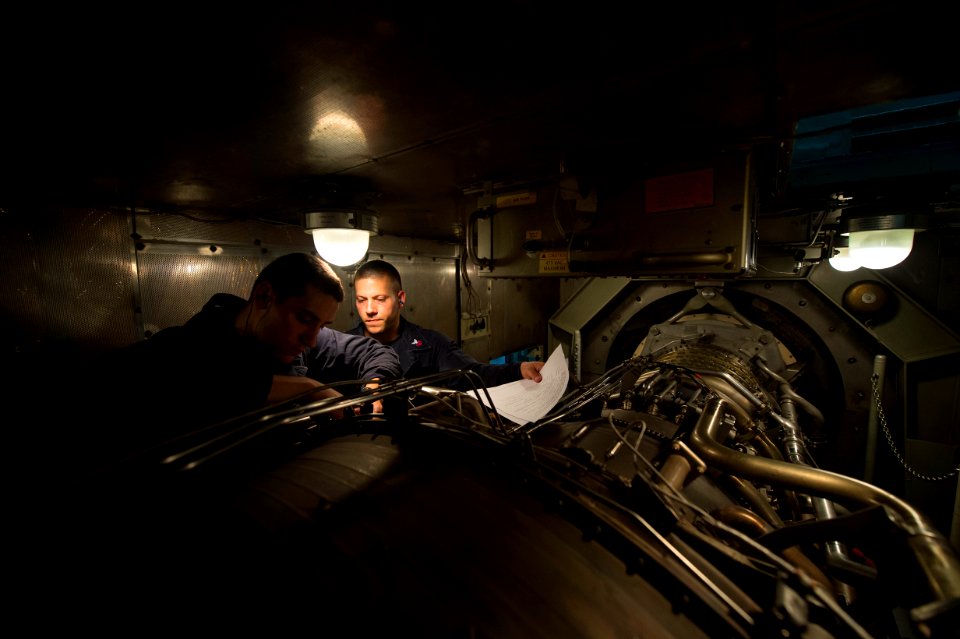 Sailors perform maintenance on a gas turbine engine. (17877032996)