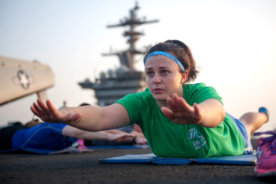Sailors perform yoga exercises. (21651925165)