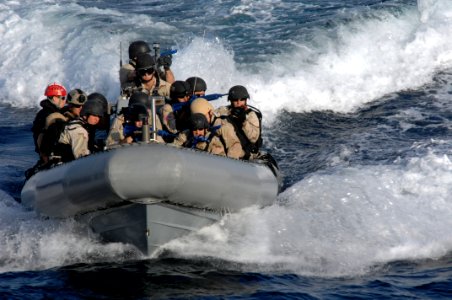Sailors ride in a RHIB during a VBSS exercise. (8427150628)
