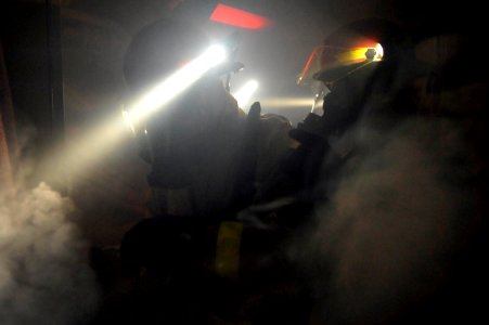 Sailors practice fire fighting at sea. (8427152486)