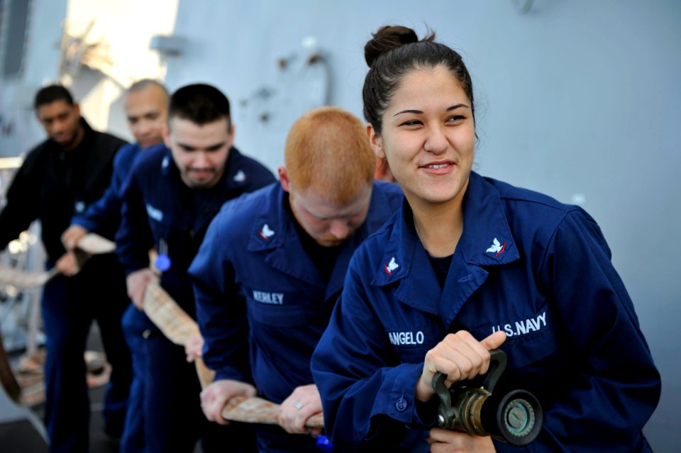 Sailors practice fire hose handling. (8283345597)