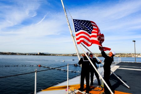 Sailors shift colors as USS Carl Vinson gets underway. (8446974505)