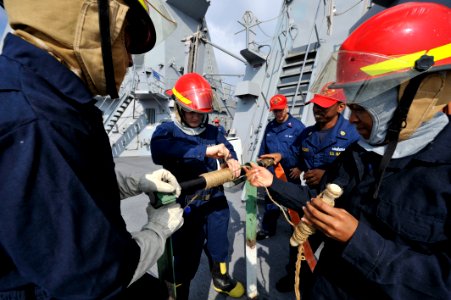 Sailors practice pipe patching techniques. (8202181093)