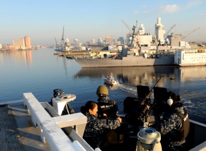 Sailors stand watch on a .50-caliber machine gun. (8246657481)