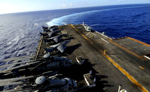 Sailors prepare aircraft for flight operations aboard the amphibious assault ship USS Peleliu (LHA 5). Peleliu is on a scheduled deployment to the western Pacific Ocean