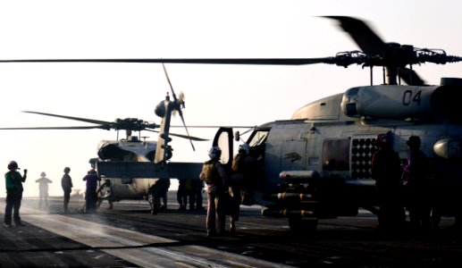 Sailors prepare MH-60R Sea Hawk helicopters on the flight deck of USS Nimitz in the Arabian Gulf. (36022202371)