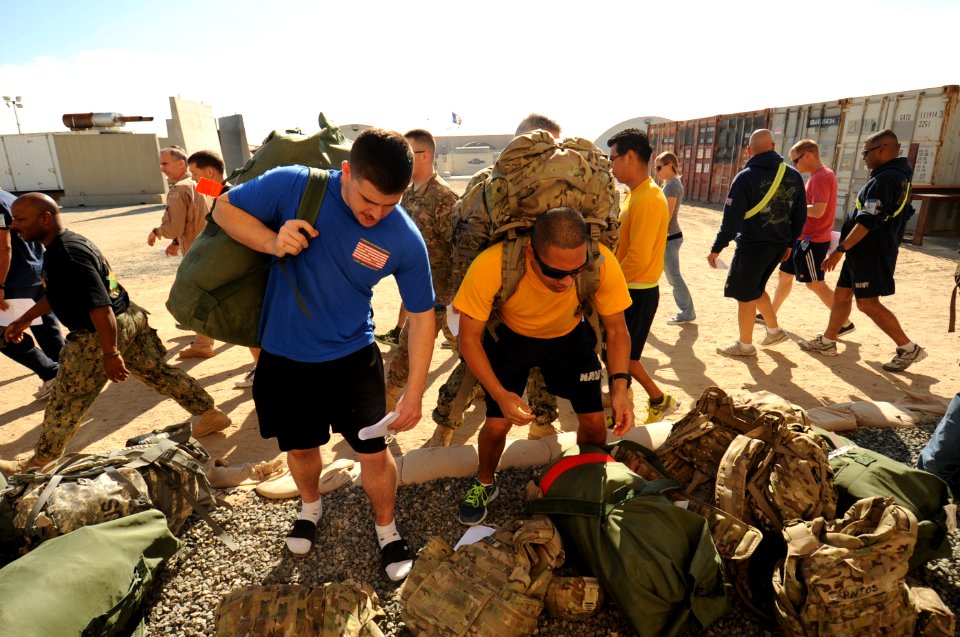 Sailors turn in gear after deployment. (8264507878)