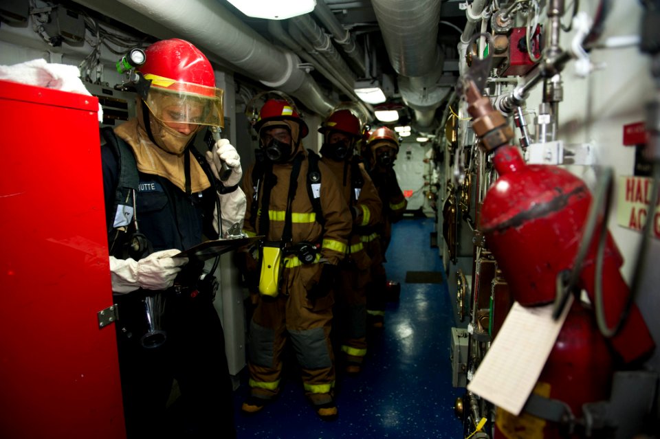 Sailors prepare to attack a simulated fire during a drill. (8591440141)