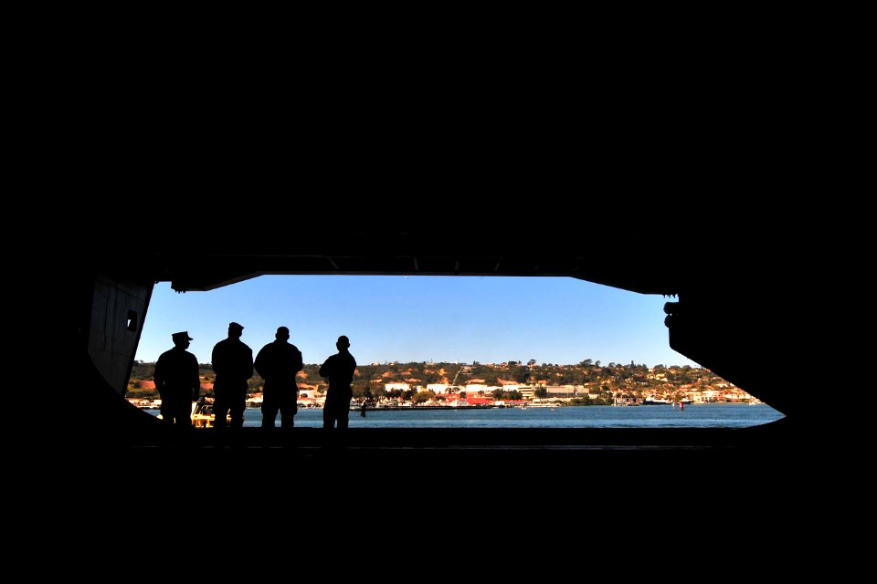 Sailors watch the shore as USS Carl Vinson departs San Diego. (8470063177)
