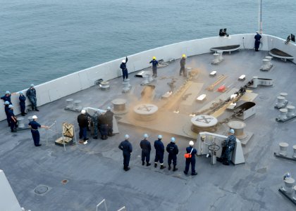 Sailors release the anchor chain aboard USS Mesa Verde. (8467236671)