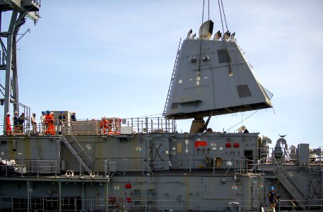 Sailors remove the exhaust funnel from USS Guardian. (8516138476)