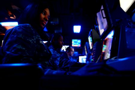 Sailors work in the combat direction center. (8471305960)