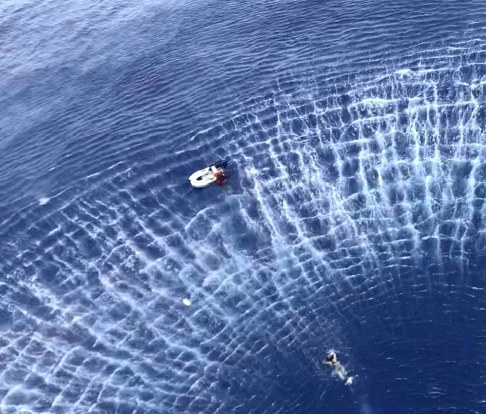 Sailor swims toward a civilian in distress aboard a sailboat during a search and rescue mission near Guam. (48380723691)