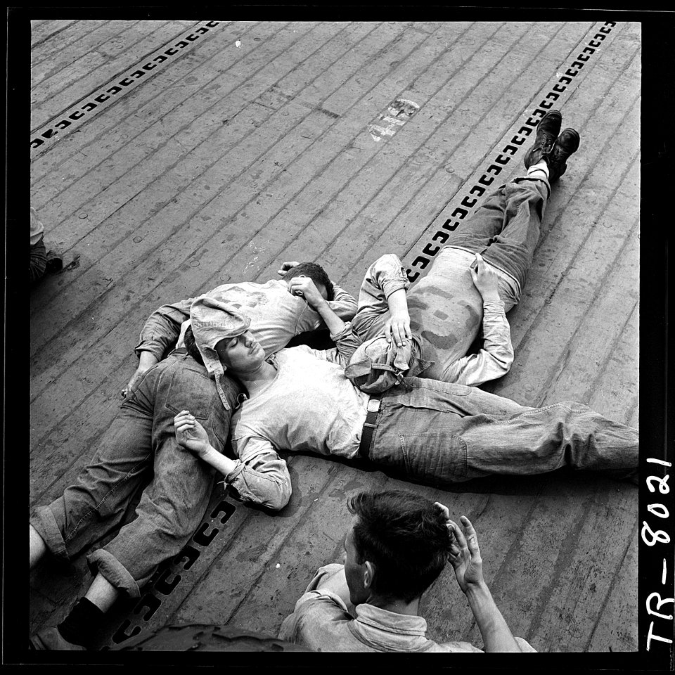 Sailors sleeping on flight deck of the USS Lexington (CV-16). - NARA - 520899