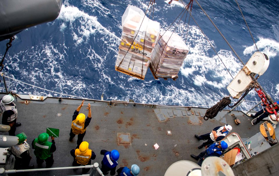 Sailors aboard the guided-missile cruiser USS Princeton (CG 59) conduct a replenishment-at-sea during Malabar 2017