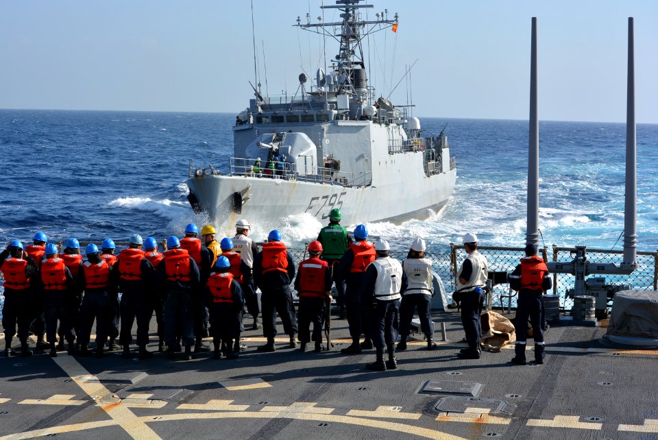 Sailors aboard USS Cole watch the French military dispatch vessel Commandant Ducuing. (16030879017)