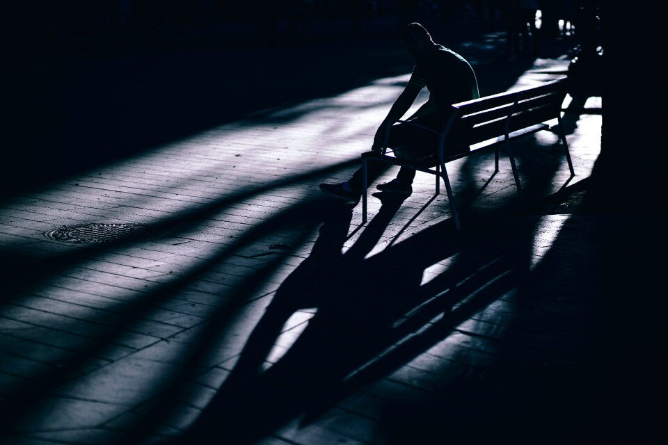 Man alone sitting photo