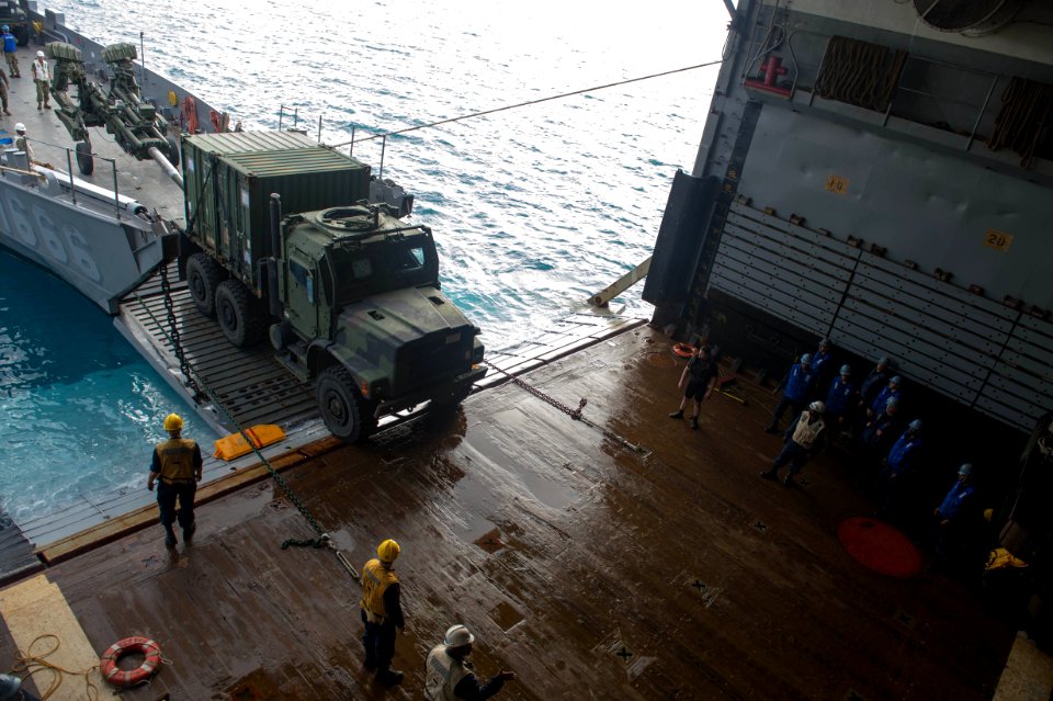 Sailors and Marines load supplies 140203-N-IC565-475