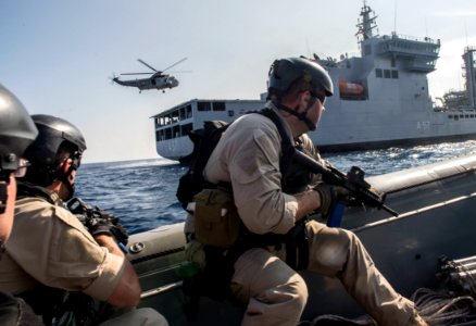 Sailors assigned to Surface Warfare Mission Package, Detachment 4, embarked aboard the USS Fort Worth train with the Indian Navy in an 11-meter rigid hull inflatable boat during a visit, board, search and seizure drill