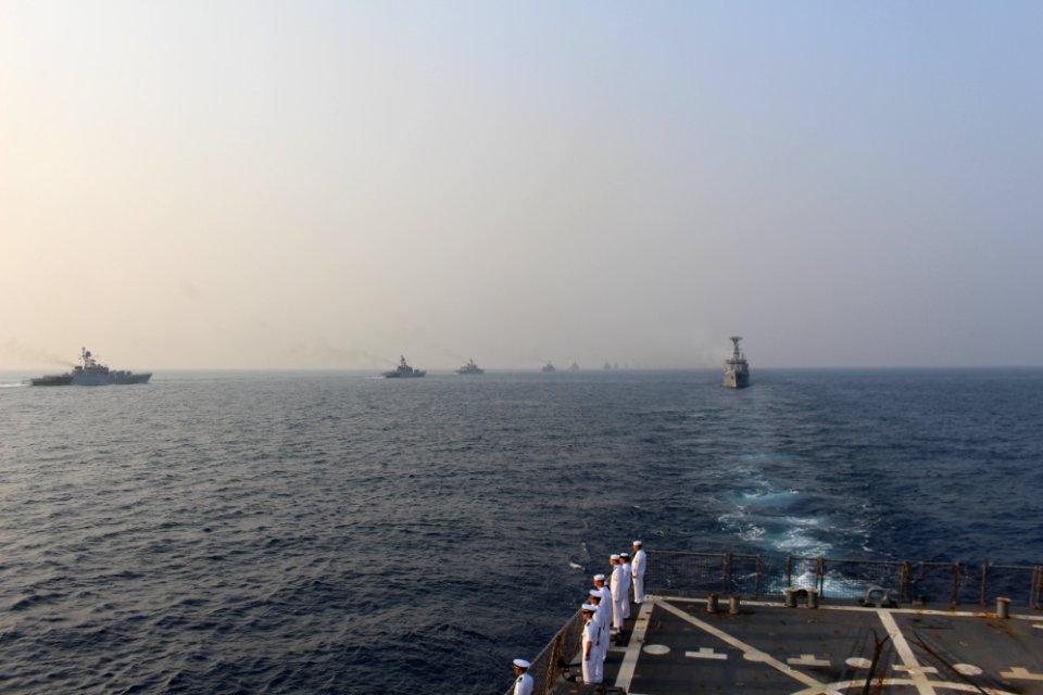 Sailors assigned to the Arleigh Burke-class guided-missile destroyer USS McCampbell (DDG 85) stand at attention for the India's International Fleet Review (IFR) 2016 passing exercise (PASSEX)