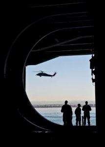 Sailors watch helicopter from Carl Vinson 130419-N-TZ605-487