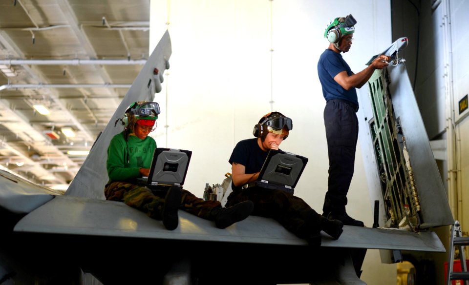 Sailors work on an F A-18. (8655745784)