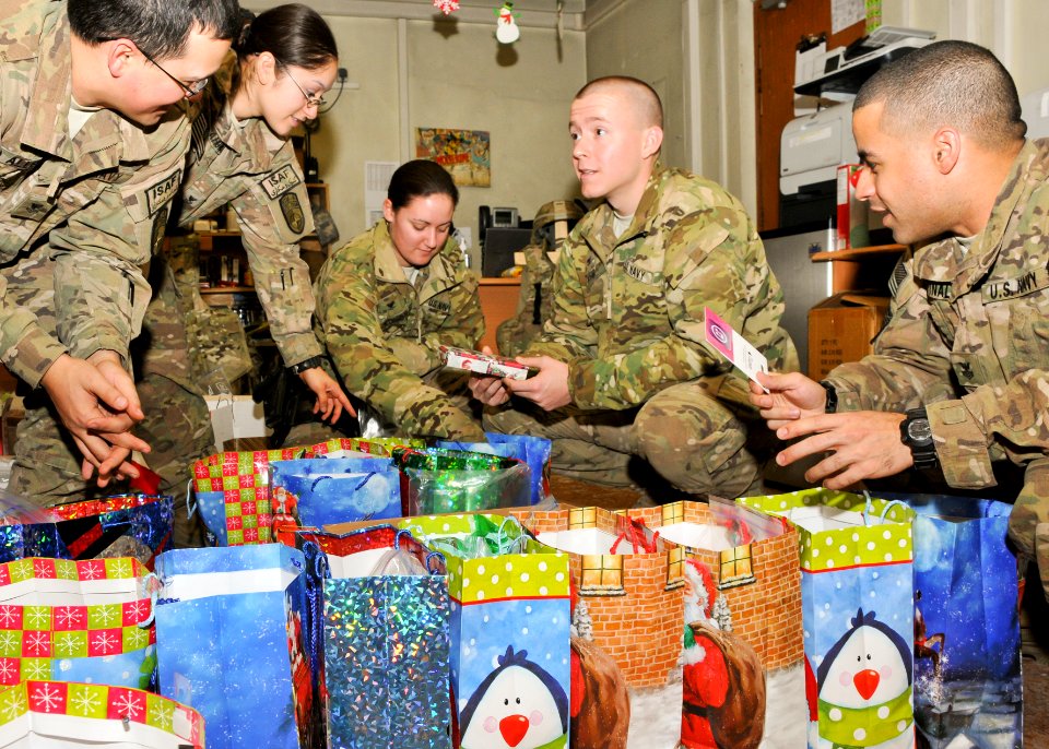 Sailors wrap gifts