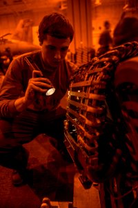 Sailors conduct aircraft maintenance aboard USS Carl Vinson 150212-N-TP834-237