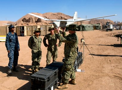 Sailor demonstrates how to use the Aqua Puma unmanned aircraft system during IMCMEX 16. (26411246582)