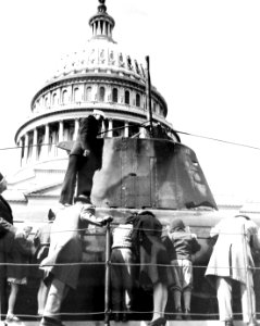 Sailor next to Japanese submarine conning tower of HA-19 at the U.S. Capitol (36865947223)