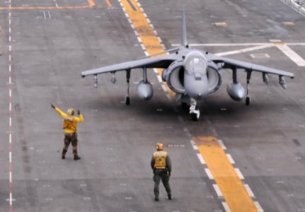 Sailors direct an AV-8B Harrier 120601-N-HF252-075