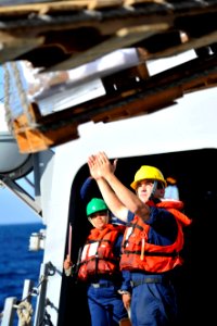 Sailors direct supplies at sea. (8270223832)