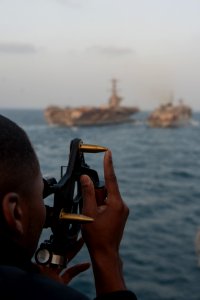 Sailor uses stadimeter during replenishment at sea (8370939796)